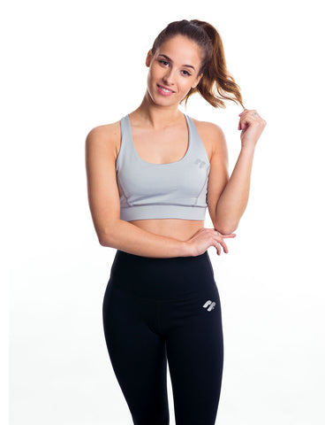 Grey strappy sports bra front view on model