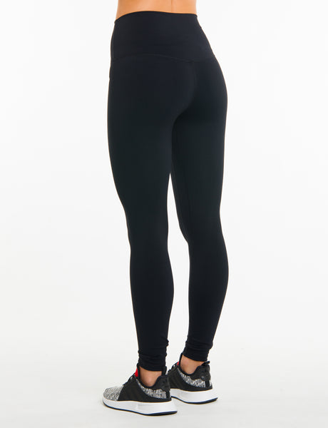 black high waisted gym leggings back view on model